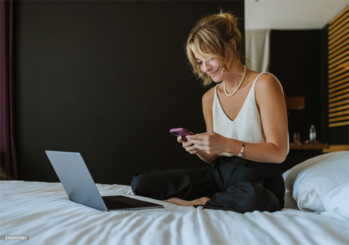 Text AI — Hotel guest using a phone in the room
